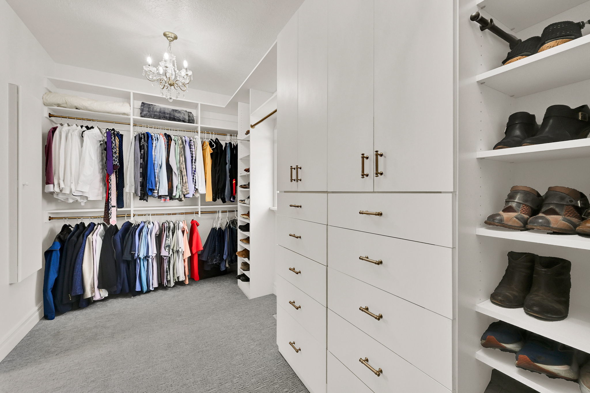 Spa-style bathroom with freestanding tub, marble finishes, and walk-in shower
