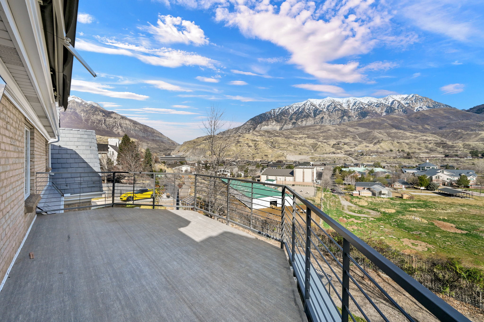 Wide view deck overlooking the Orem valley and snow-capped Wasatch mountains
