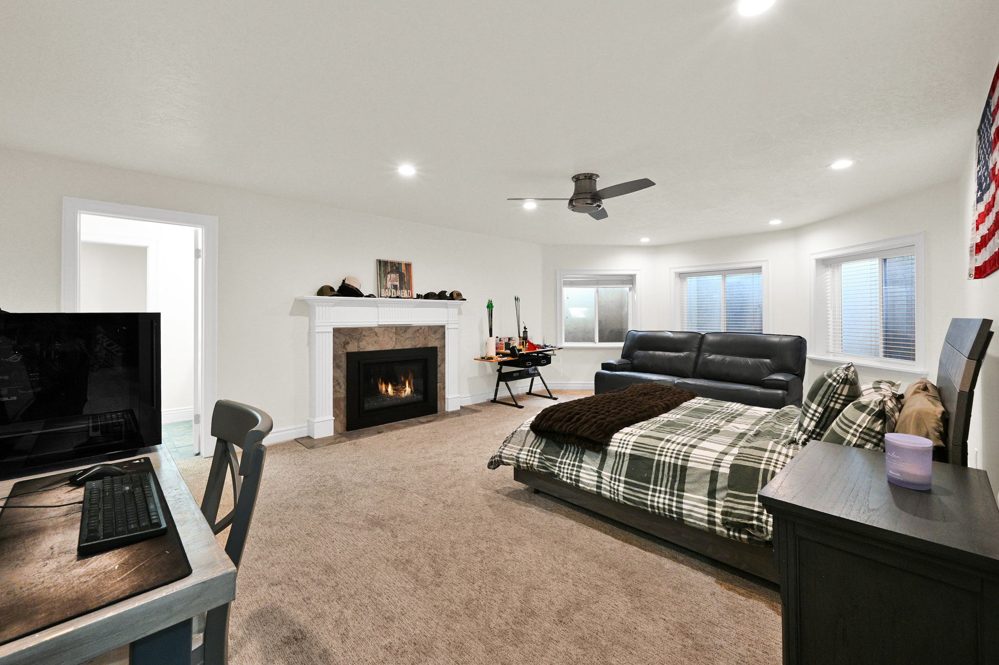 Game room with red pool table, table tennis, fireplace, and doors to the patio